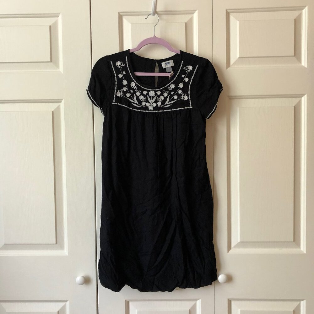 Black swing dress with white floral embroidery